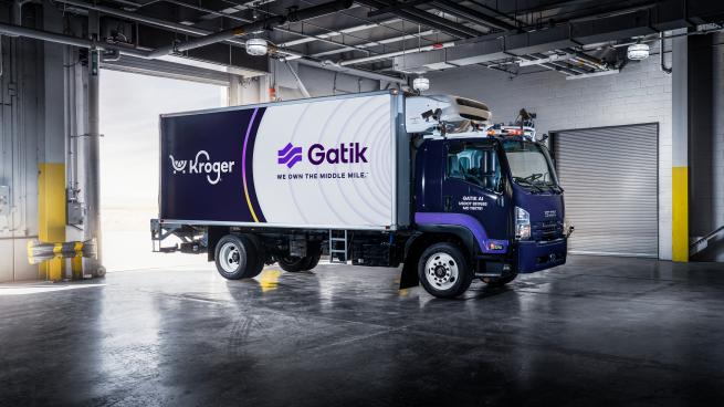 A photo of a Gatik/Kroger truck in a warehouse.