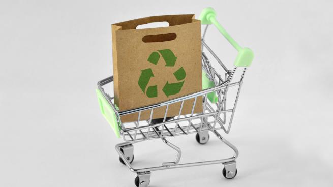 recycling symbol on bag in shopping cart