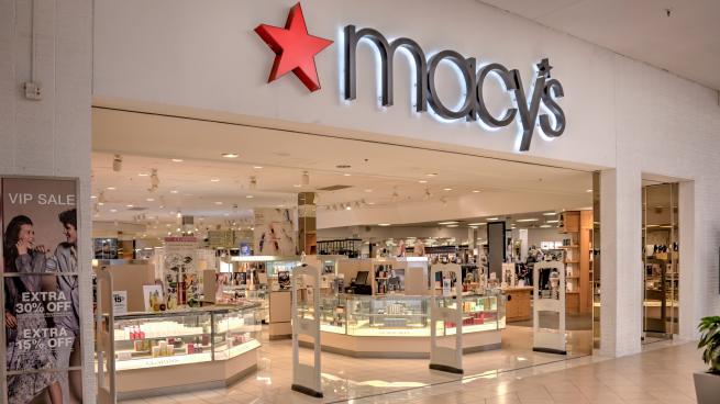 A macy's storefront in a shopping mall.