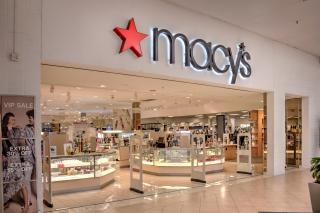 A macy's storefront in a shopping mall.